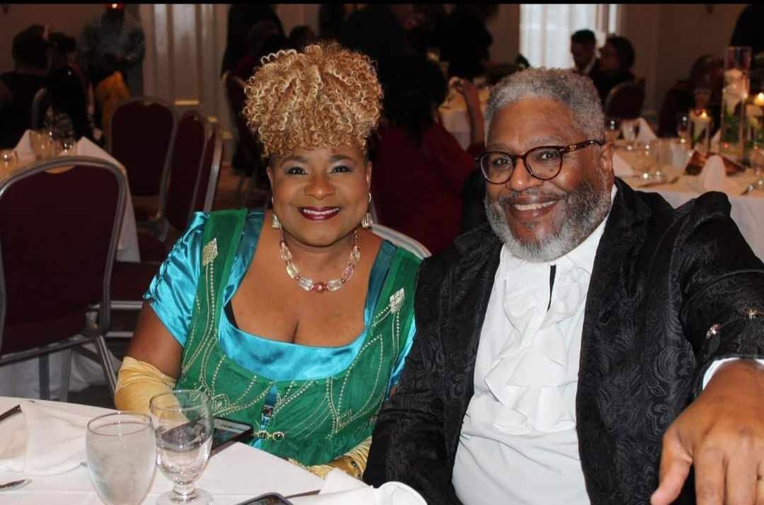 Guest in Black & Gold Gown at the 10th Annual BMR Step-and-Repeat